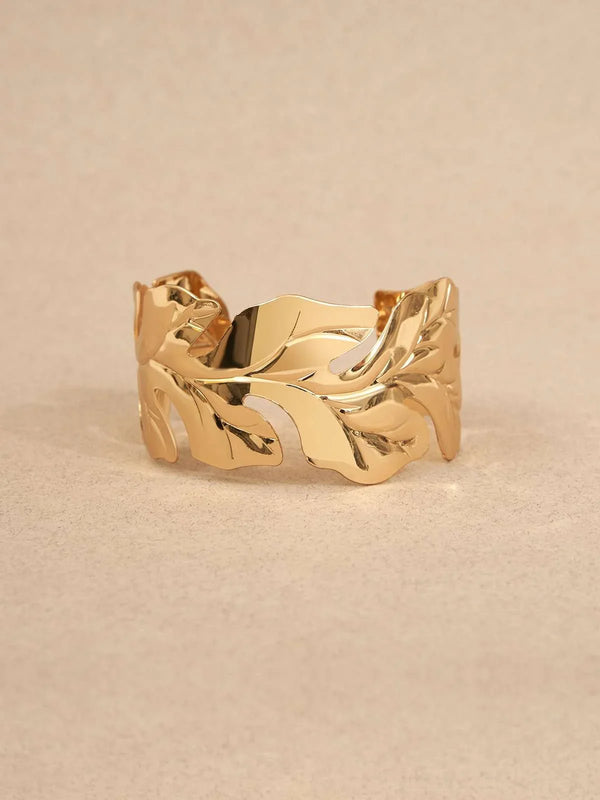 Gold-plated leaf cuff bracelet.